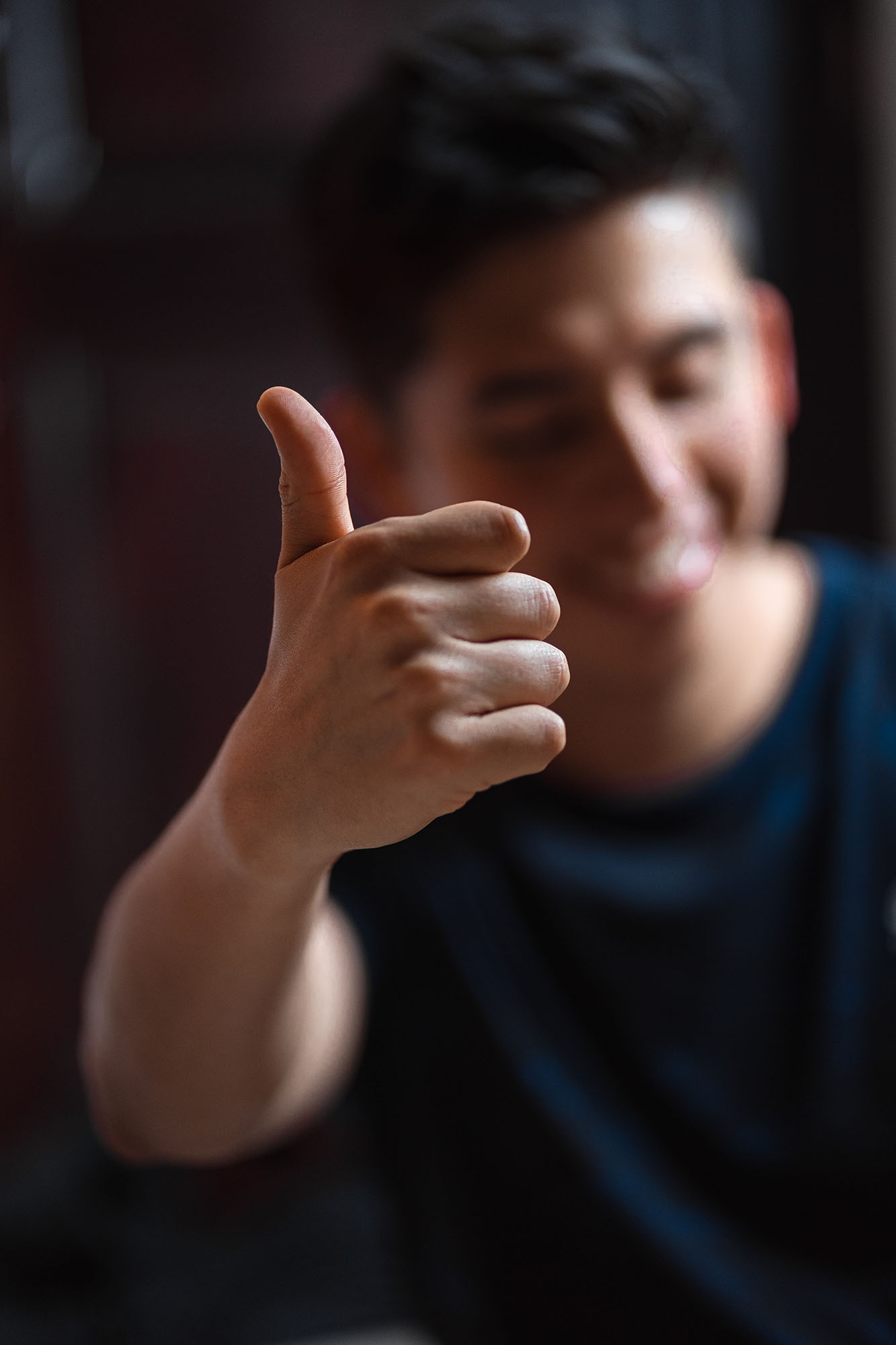 thumbs up with blurred background